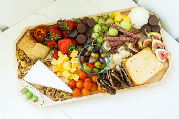 martini olive mini on a charcuterie JK Adams wood board filled with food