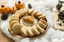pumpkin pie mini on circle wood board with cookies