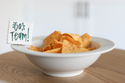 simple scallop to write your message  of "go team" on a pinstripes baby bowl filled with chips