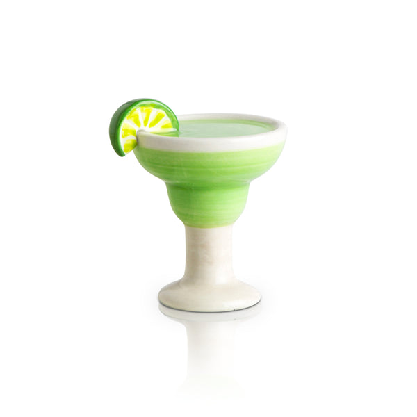 lime and salt margarita mini with a wedge of lime and green drink
