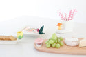 hummingbird mini with tulip and mushroom and pink flower on a woodboadr