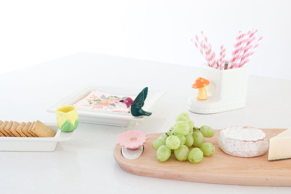 hummingbird mini with tulip and mushroom and pink flower on a woodboadr