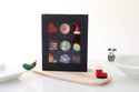 elf mini with santa boot mini and christmas pickle mini with a black keepsake box of multiple minis