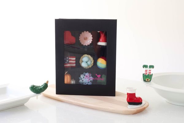 elf mini with santa boot mini and christmas pickle mini with a black keepsake box of multiple minis