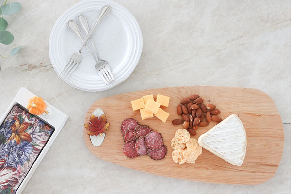 fall leaf and woodboard and cheese and nuts