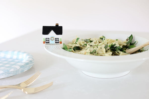 home sweet, home mini on pinstripes bowl with a bowl of pasta