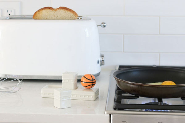 basketball mini on salt and pepper shakers with toast and eggs