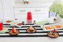 football mini on divided dish, ketchup and mustard mini on dainty dish, pumpkin mini on dainty dish, grill on dainty dish, acorn on utensil crock and Maison jar mini on cracker tray