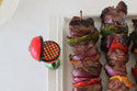 grill mini on a platter with kabobs