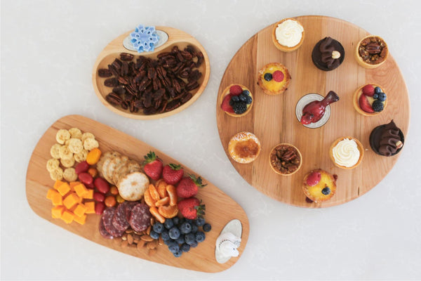 wood boards and snowflake mini, polar bear mini and cardinal mini filled with assorted food