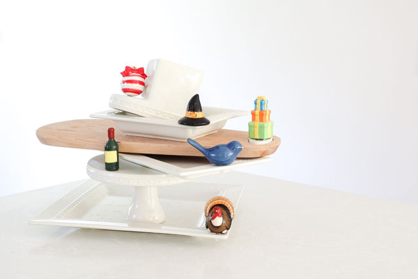 birthday present mini with witch hat, ornament, wine, bluebird of happiness and wine minis on square platter, cake stand and wood board