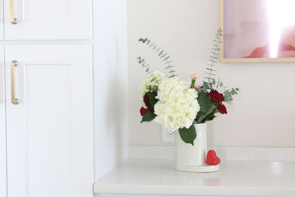 red heart mini and cutie container with flowers