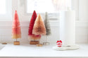 red and white ornament and melamine paper towel holder
