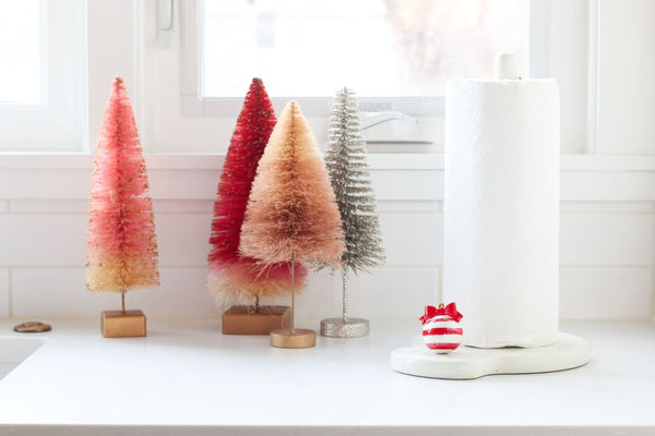 red and white ornament and melamine paper towel holder