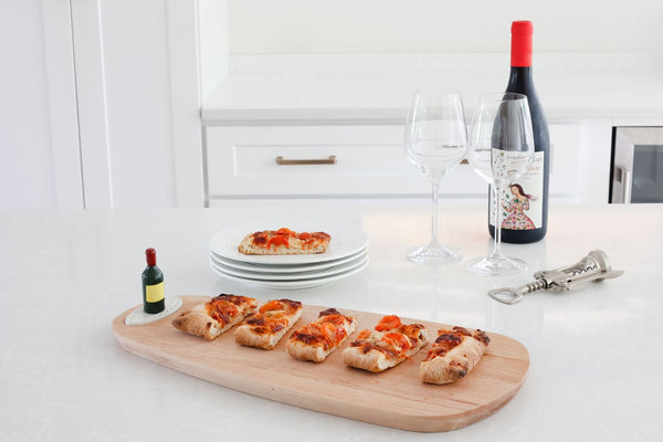 red wine and pizza and wood board