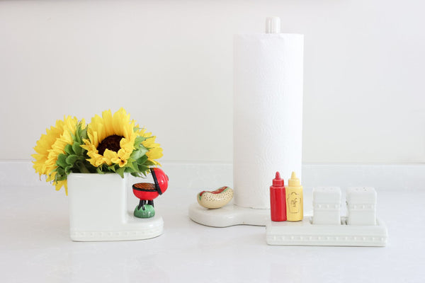 grill mini and mustard and ketchup and hot dog with sunflowers in a cutie container and melamine paper towel holder with salt and pepper shakers