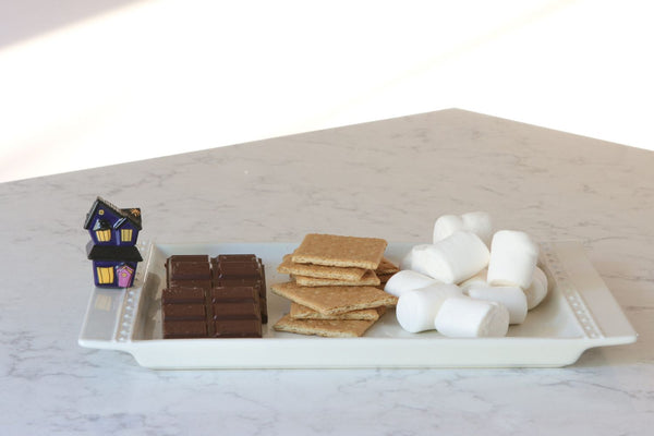 haunted house mini on a tray with smores ingredients