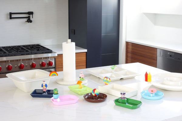 flamingo, uncle sam, cactus, beach ball, mushroom, peace, ketchup and mustard, pink flower, beer can and rainbow minis with paper towel holder, dainty dish, towel holder, divided dish, chip and dip platter in a kitchen