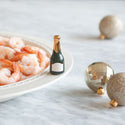 champagne mini and shrimp on a platter