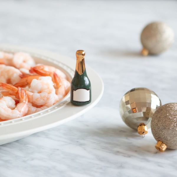 champagne mini and shrimp on a platter