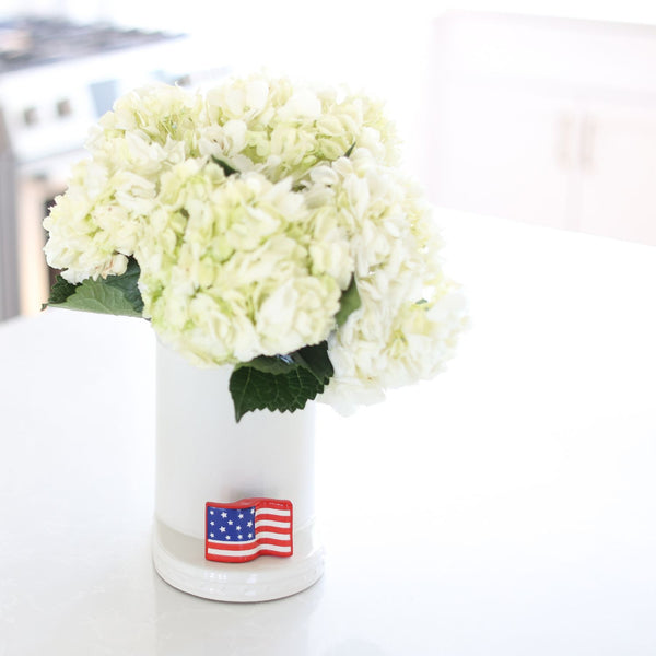 american flag mini with utensil crock filled with hydrangeas