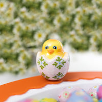 chick in egg mini on a round platter with an orange band