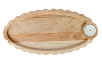A wooden, oval-shaped, scalloped edge serving tray with a decorative hole in one corner, displaying a natural wood pattern.