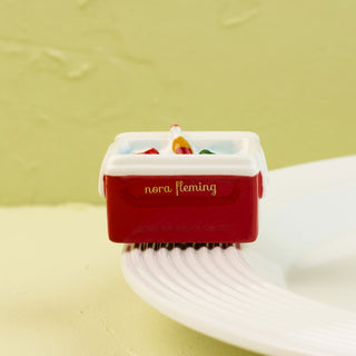 red and white cooler mini on light green background
