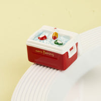 red and white cooler mini on light green background