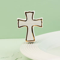 Cross-shaped mini on a light green background