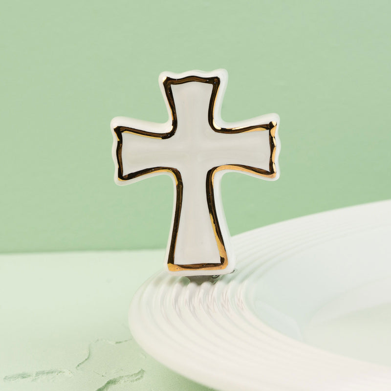 Cross-shaped mini on a light green background