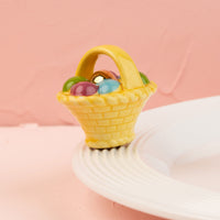 easter basket mini on a white platter and pink background