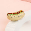 Hot dog mini on a white plate with a pink background