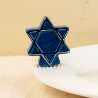 Blue Star of David ring on a beige background
