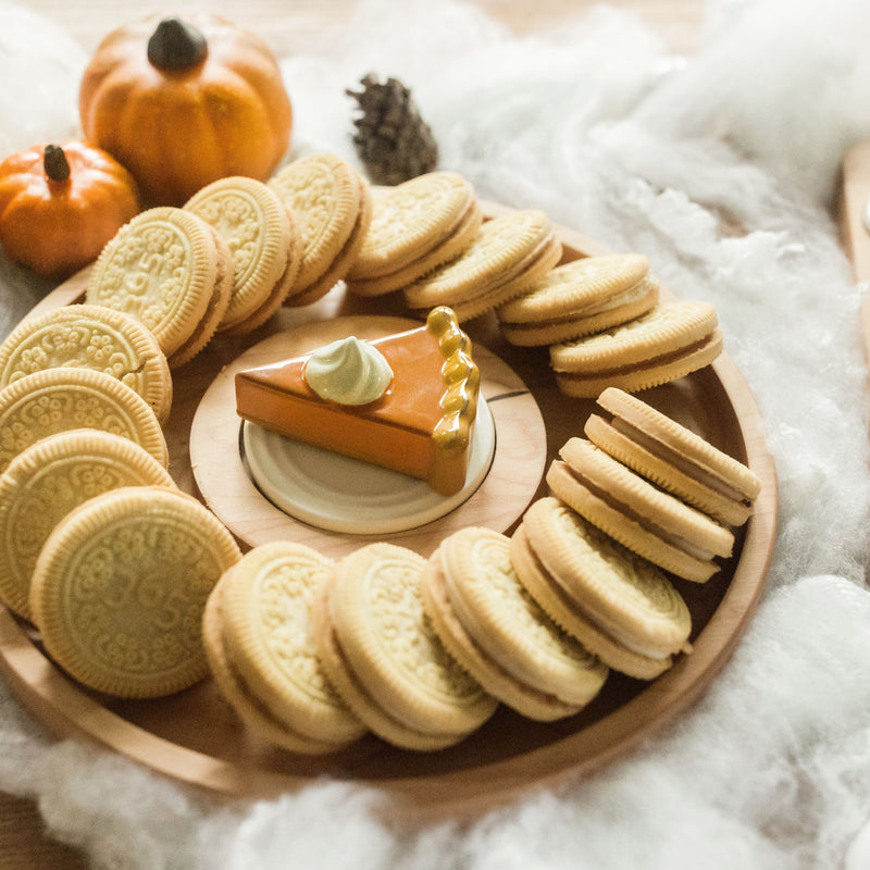 pumpkin pie mini on circle wood board with cookies