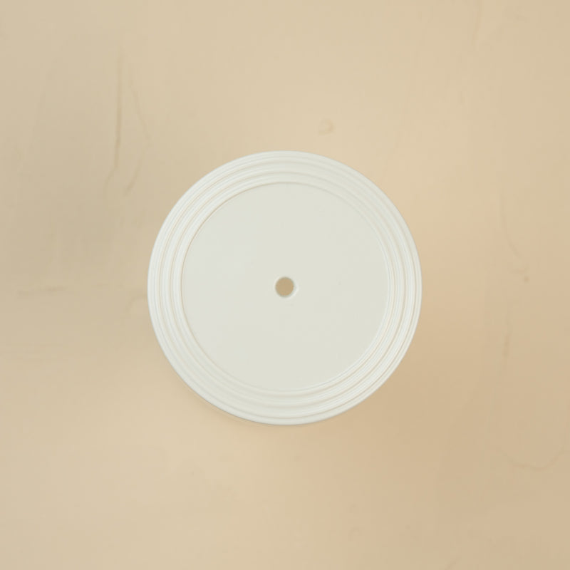 top view of a pinstripes melamine lid with a glass large canister