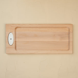 This image features a handcrafted maple bread board designed by J.K. Adams