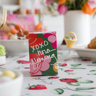 especially for you gift box with xoxo nora fleming on the front. the box is sitting on a decorated table.