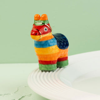 Colorful llama-shaped mini on a white surface with a light green background