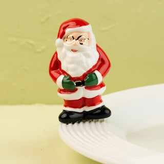Santa Claus on a white plate with a green background