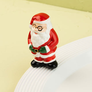 Santa Claus on a white plate with a green background