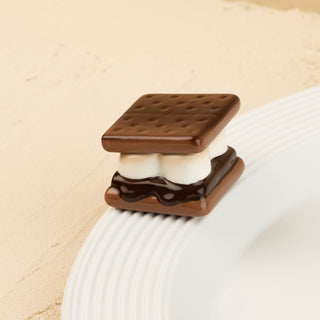 Miniature s'mores minin on a beige background