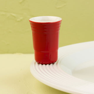 solo cup mini on white platter on a light green background