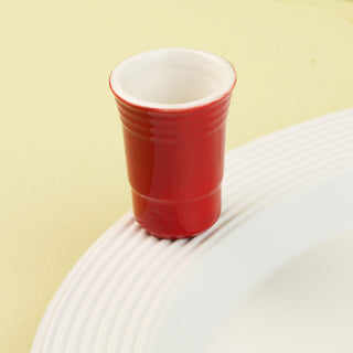 solo cup mini on white platter on a light green background