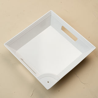 White rectangular tray with a handle on a beige background