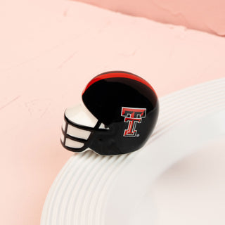 texas tech football helmet mini with red and white accents on a pink background