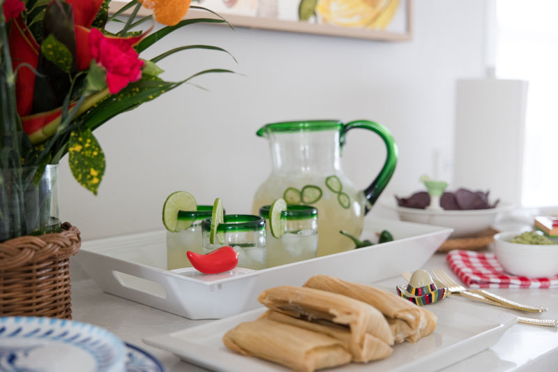 heat wave pepper mini on a rectangle white tray with margaritas, tamales and chips.