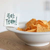 simple scallop to write your message  of "go team" on a pinstripes baby bowl filled with chips