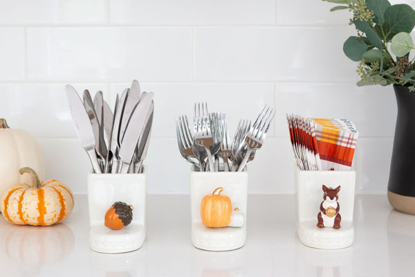 acorn mini with pumpkin mini and squirrel mini all on square cutie containers filled with silverware