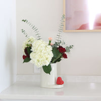 red heart mini and cutie container with flowers